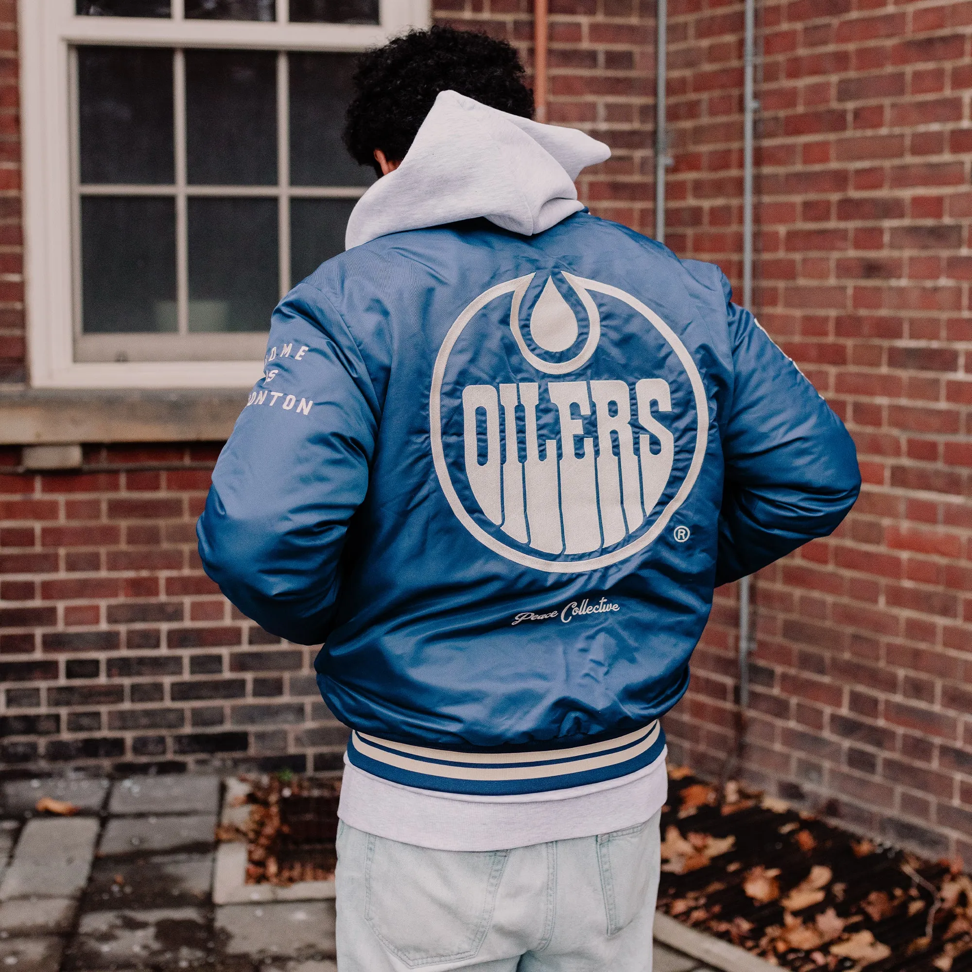 Edmonton Oilers Unisex Peace Collective Blue Vintage Bomber Jacket